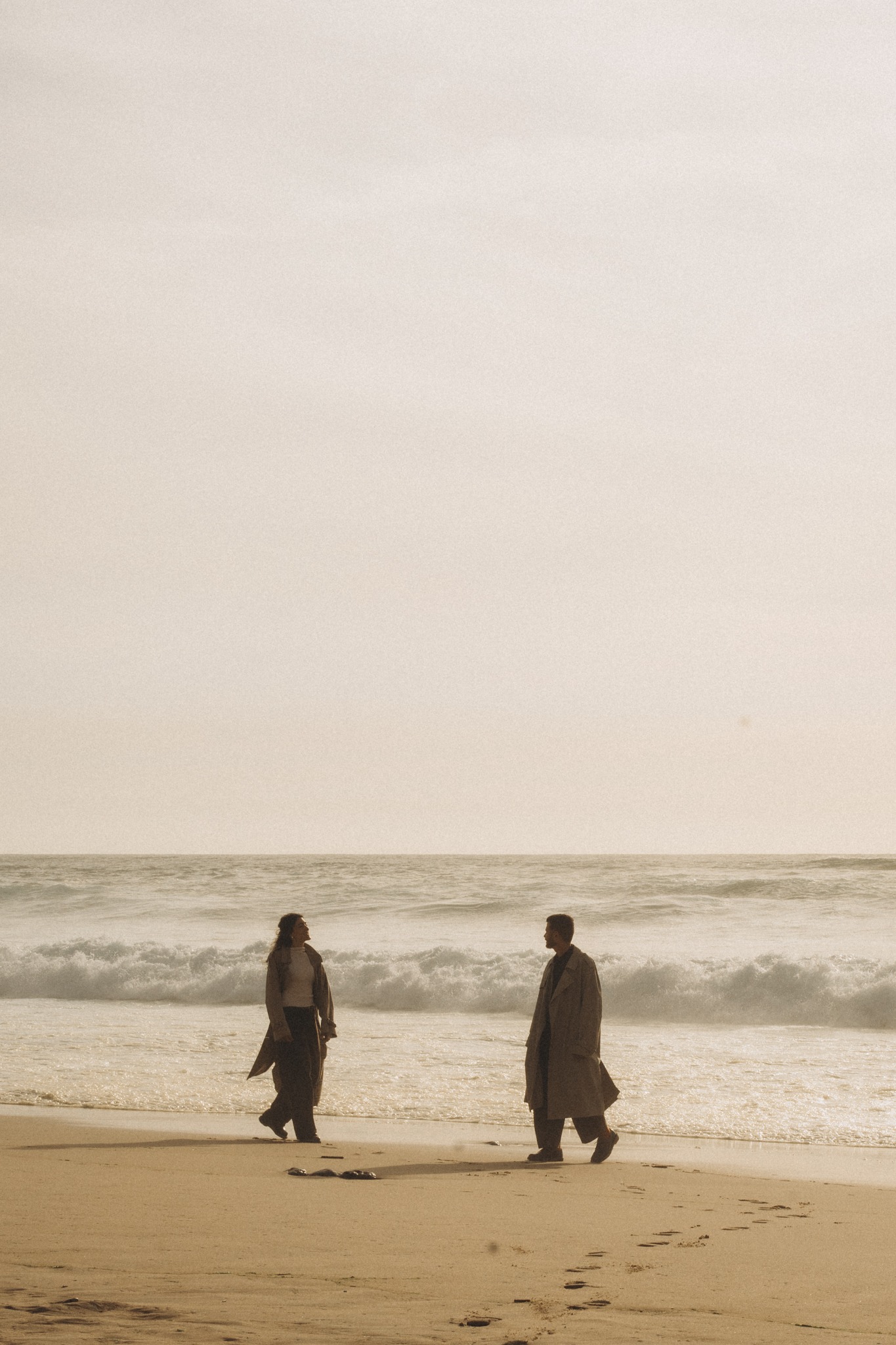 Couple meeting on a wide Atlantic beach
