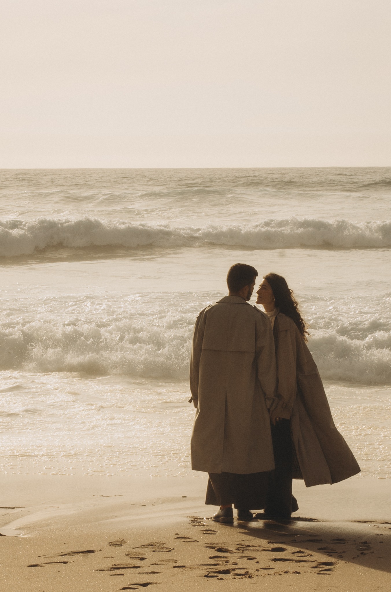 Couple standing together in front of the Atlantic