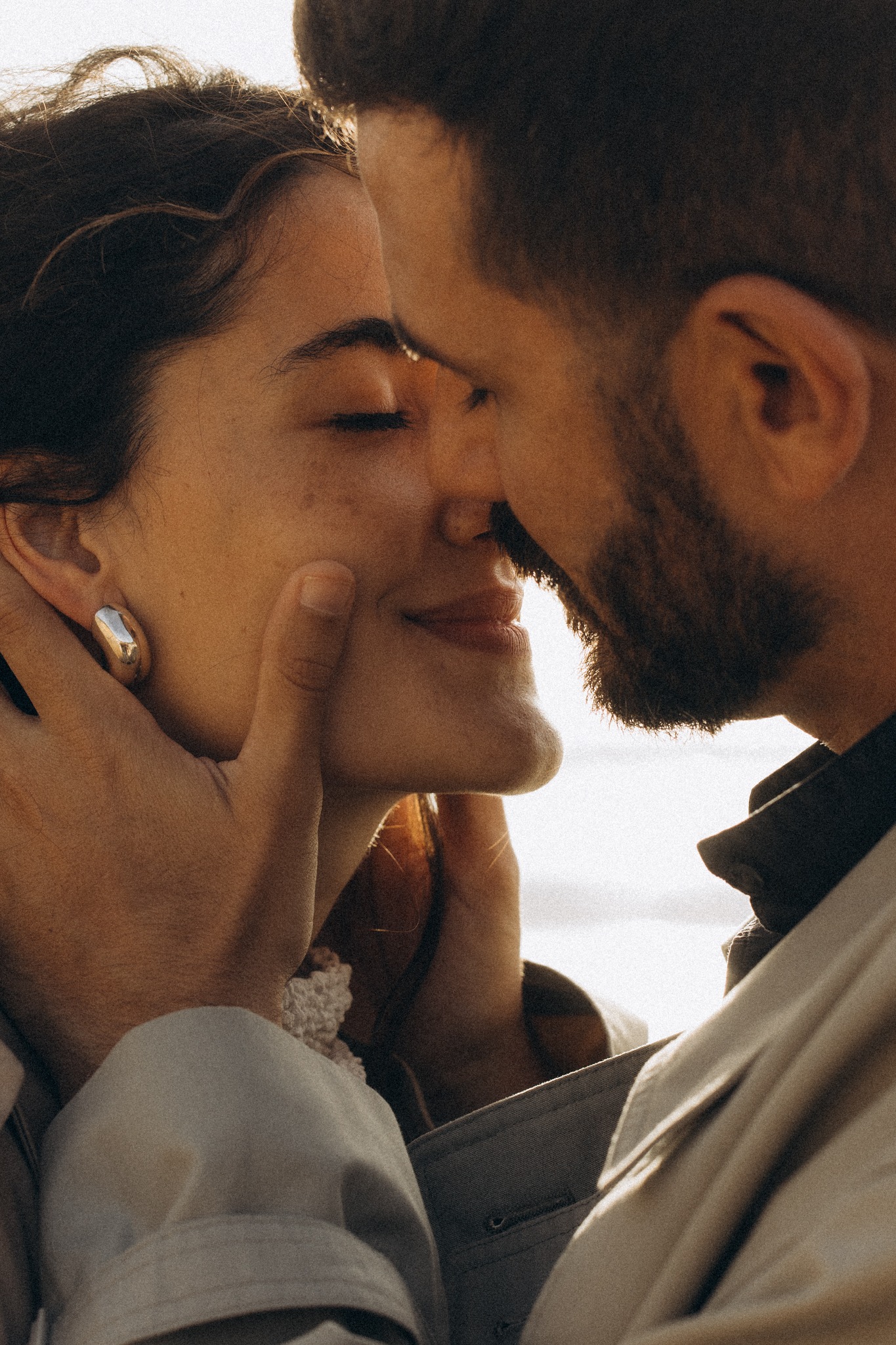 Couple almost kissing by the Atlantic