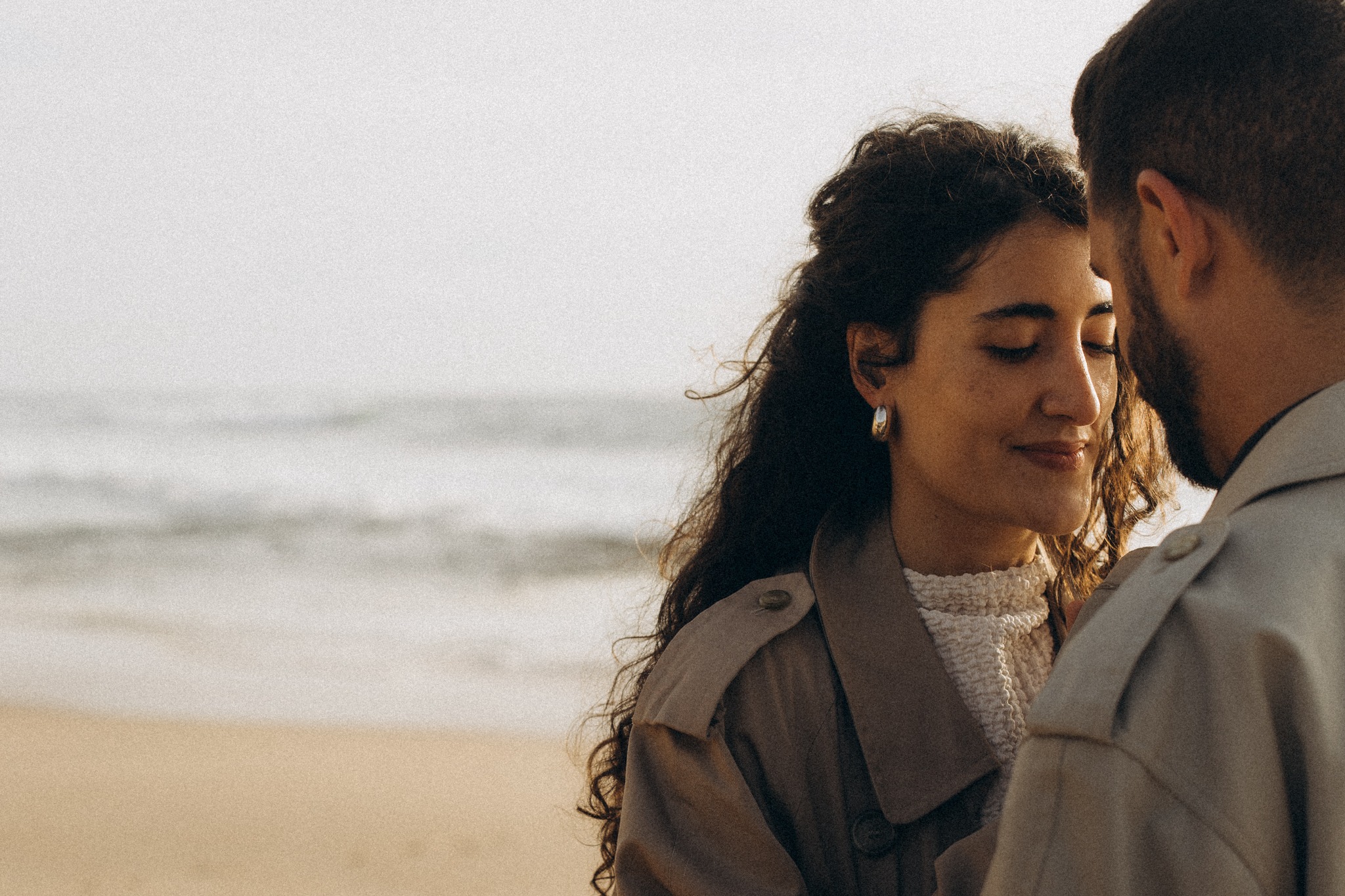 Couple sharing a quiet moment by the Atlantic