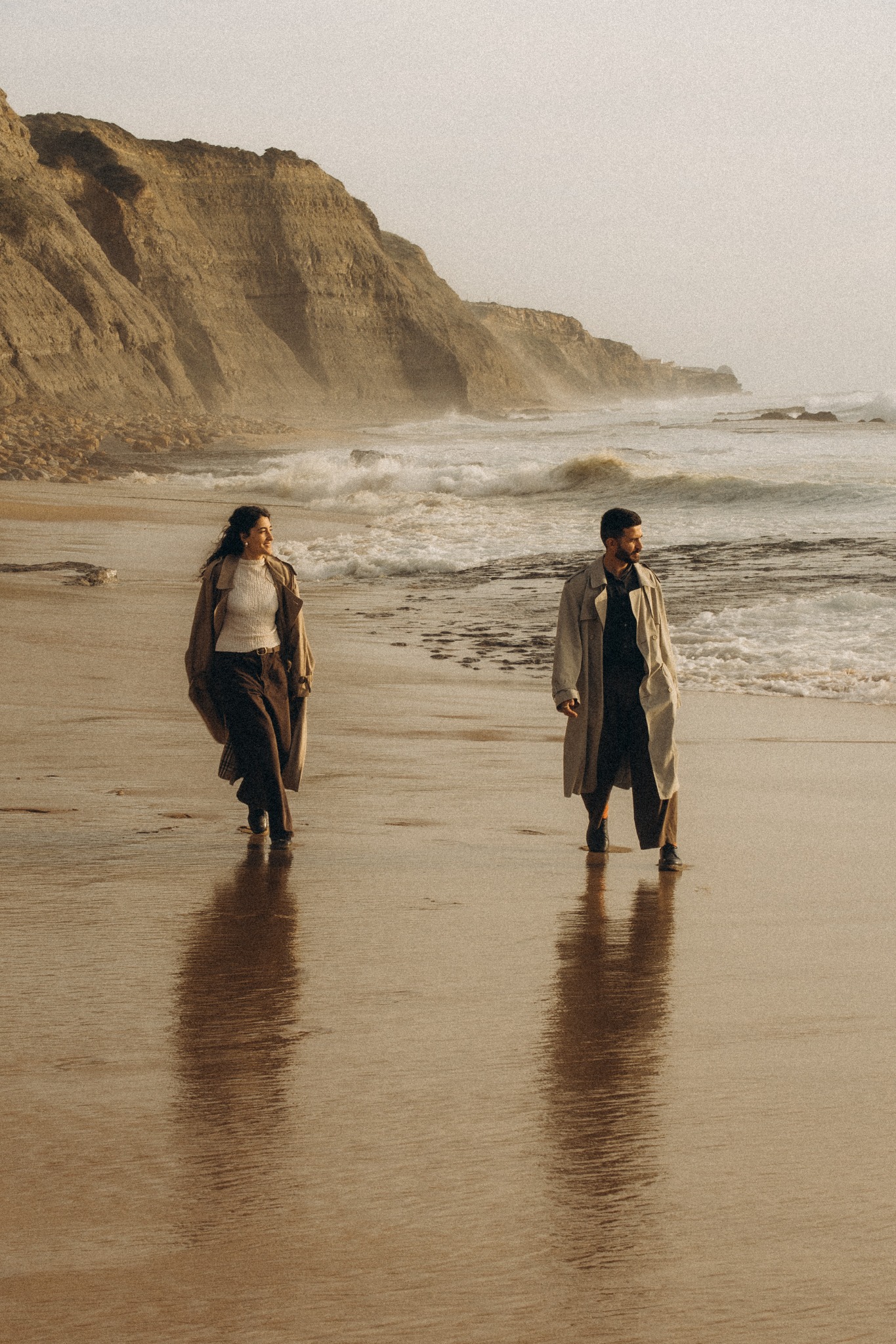 Couple walking beside the Atlantic
